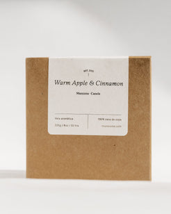 A square kraft paper box with a white label reading 'Warm Apple & Cinnamon' and 'Mazatlan, Mexico' on a clean white background.
